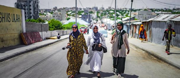 Women journalists walking in the streets